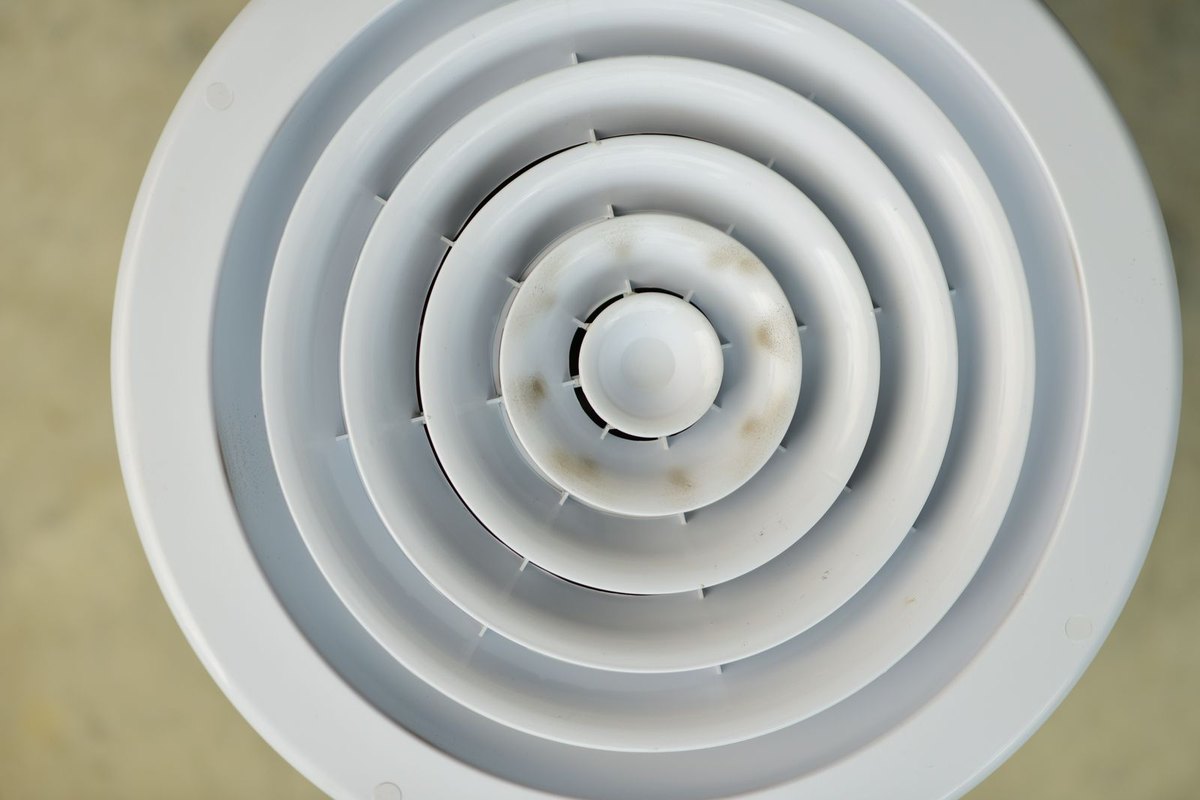 Close-up of a round ceiling air vent in Anchorage
