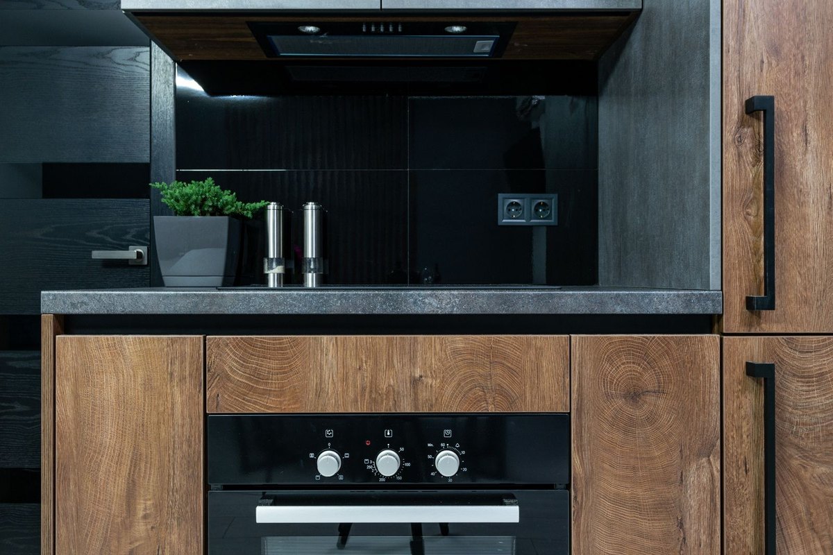 Updated kitchen with refaced wood-tone cabinets in Anchorage, AK