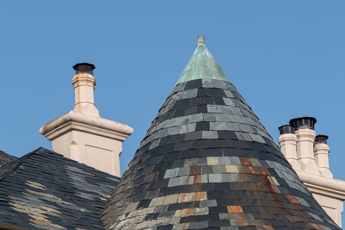 Chimney stacks with caps on a rooftop in Anchorage, AK