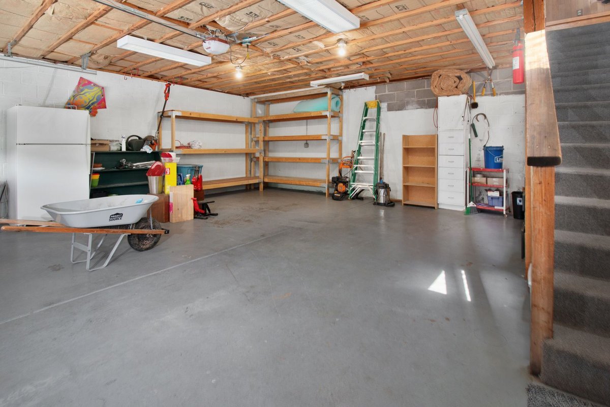Garage interior with wall storage shelving and organized tools in Anchorage, AK