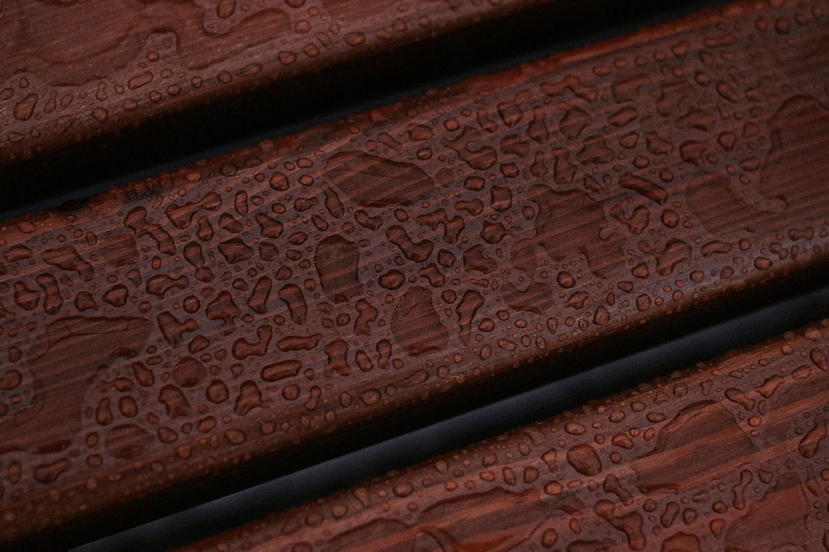 Water beading on a sealed wood surface