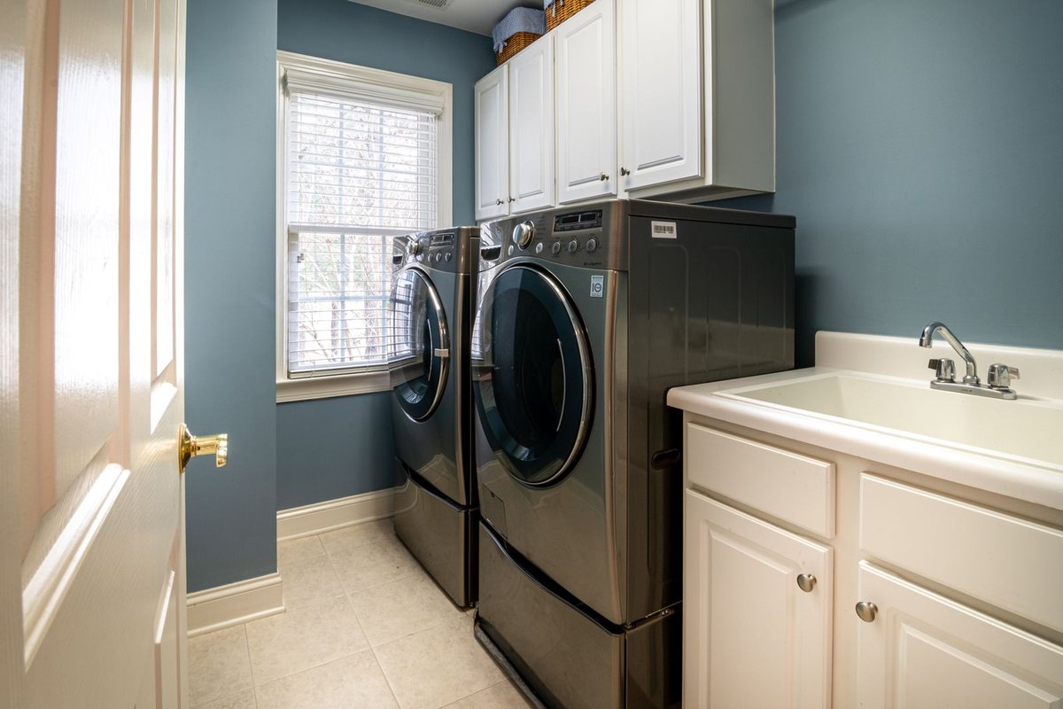 A clean, organized laundry room with modern appliances