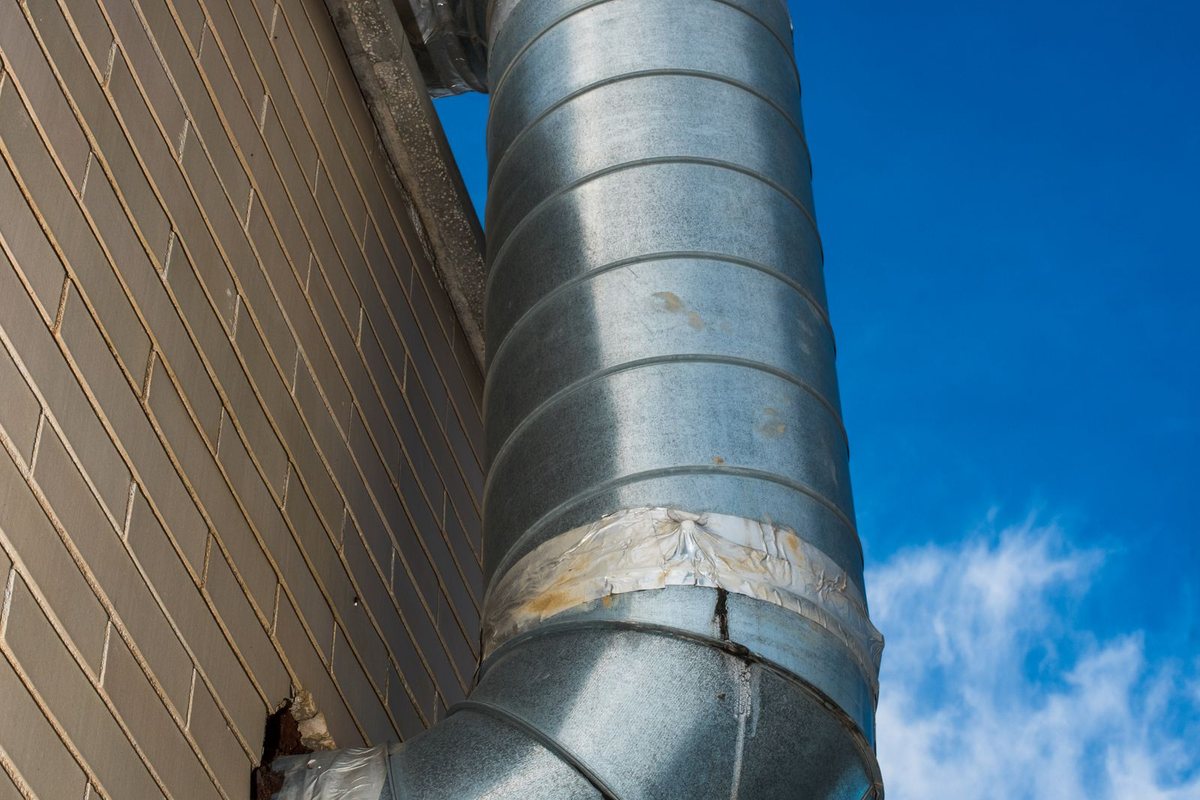A ventilation duct running along a wall