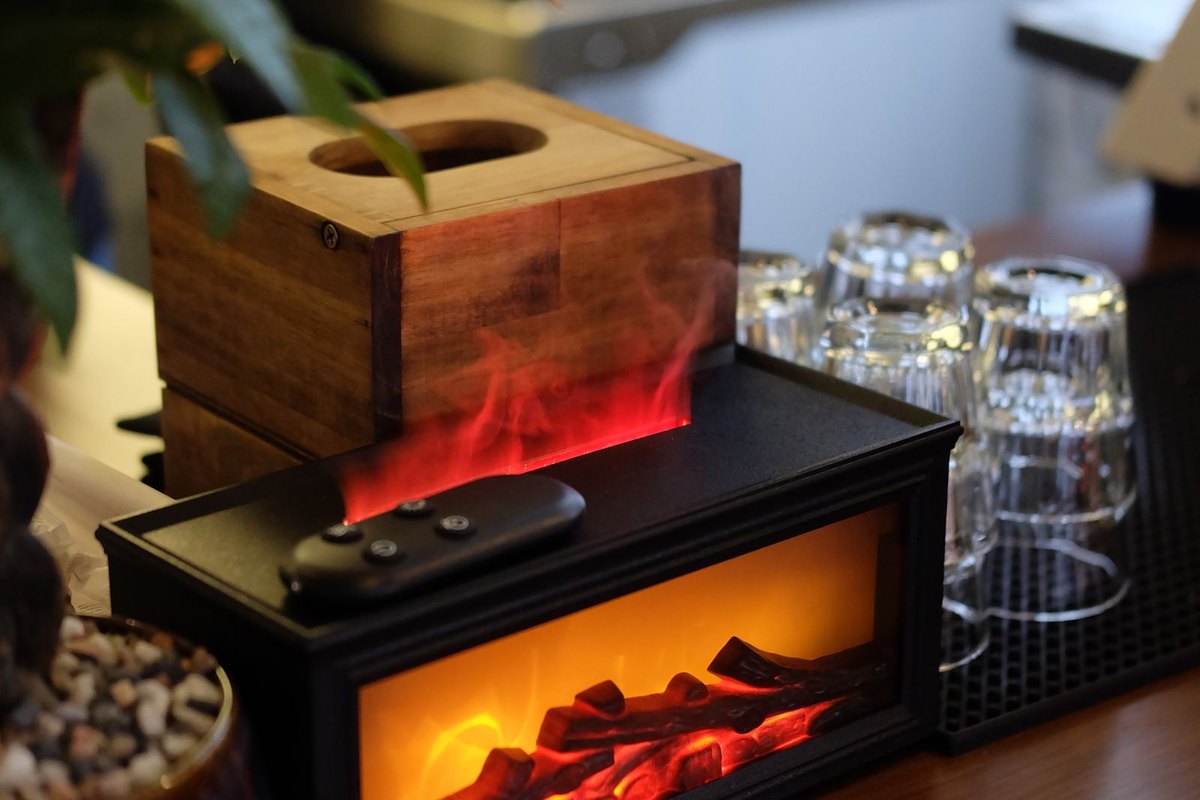 Electric fireplace with a glowing flame effect in a Anchorage, AK room