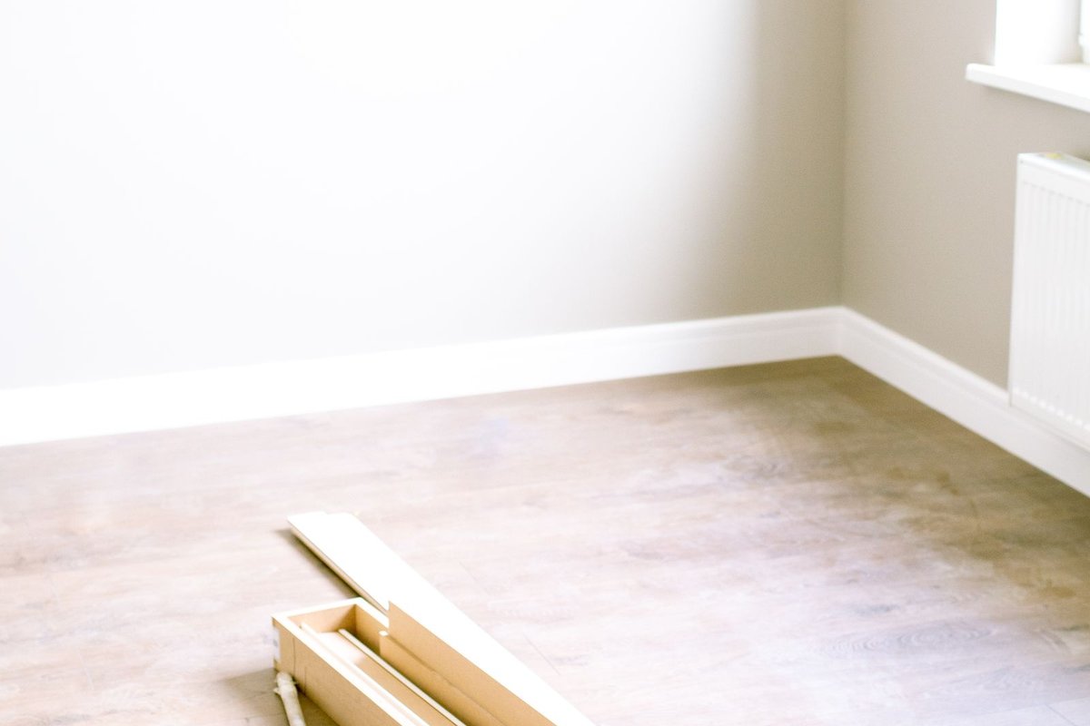 Empty room with the floor stripped back during a renovation