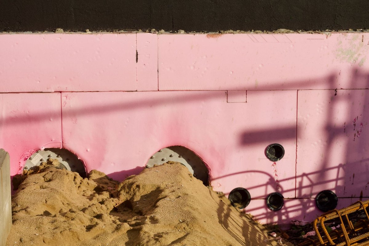 Pink fiberglass insulation on a wall in a Anchorage home