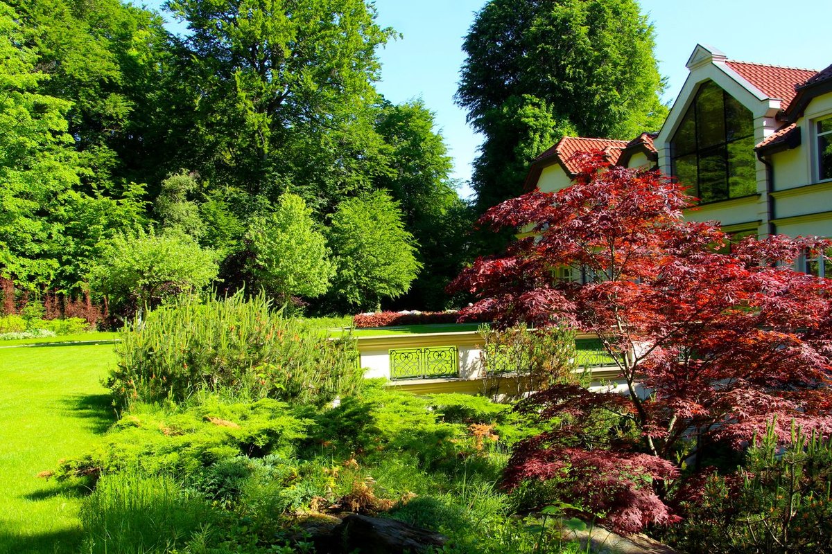 Designed and installed residential landscape with planted beds and lawn in Anchorage, AK