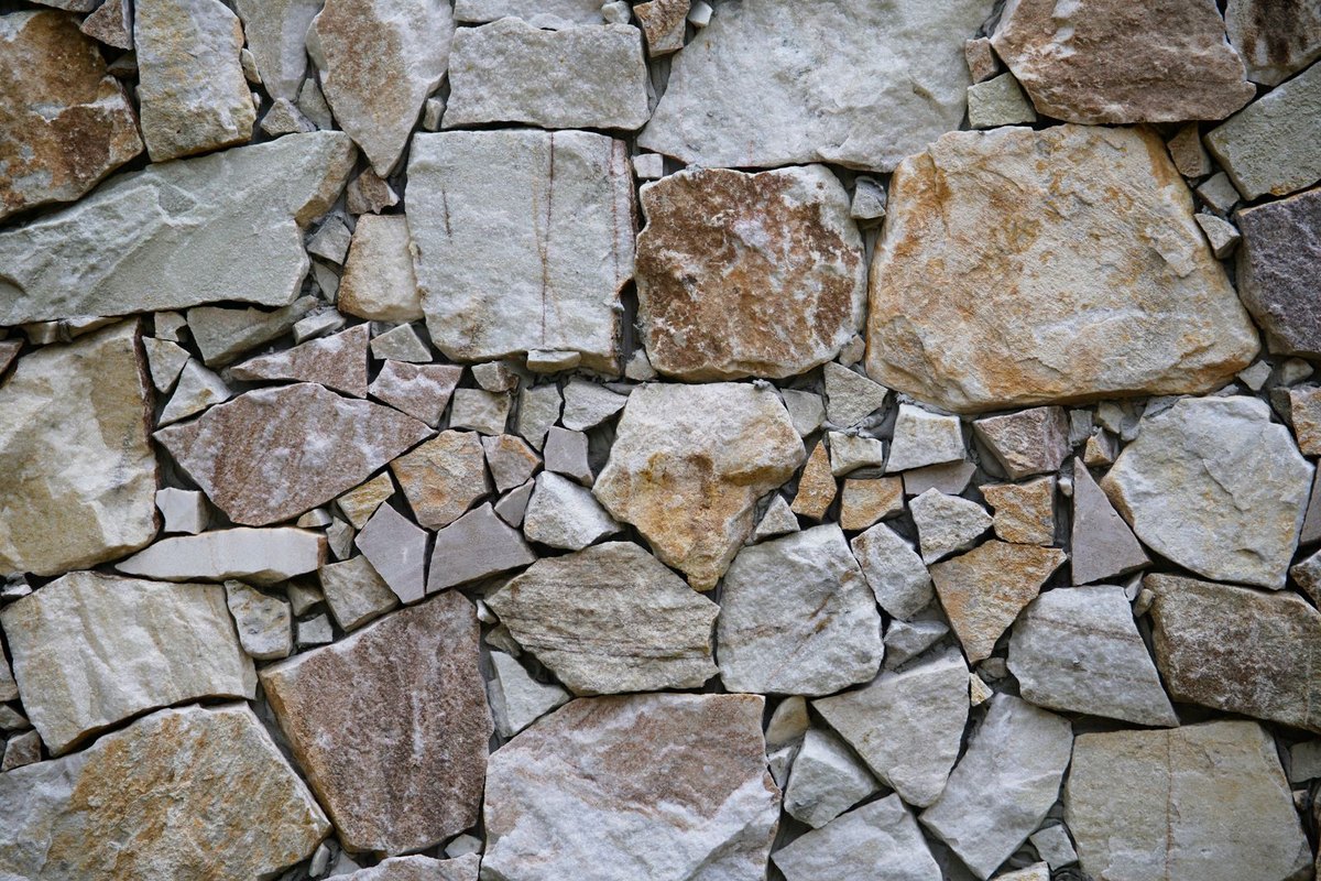 Stone masonry wall being repaired and repointed in Anchorage, AK