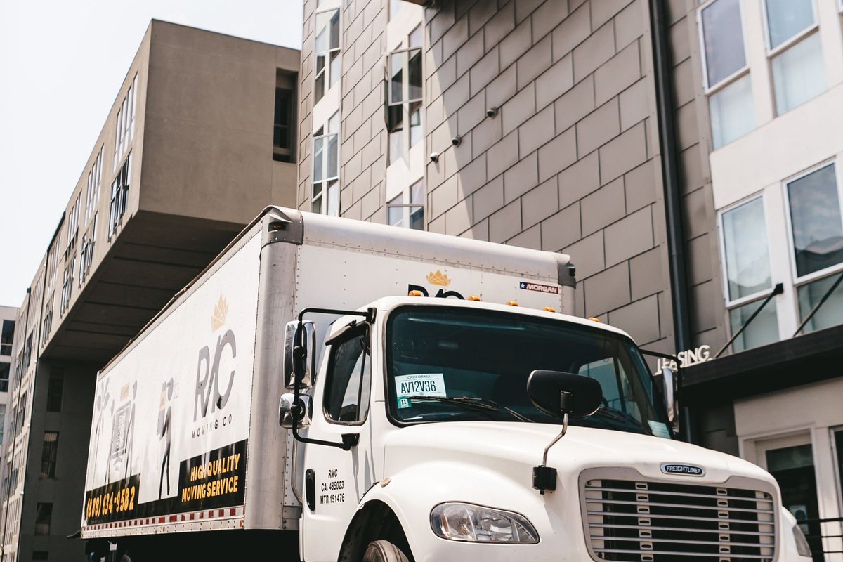 A moving truck parked outside an apartment building in Anchorage, AK