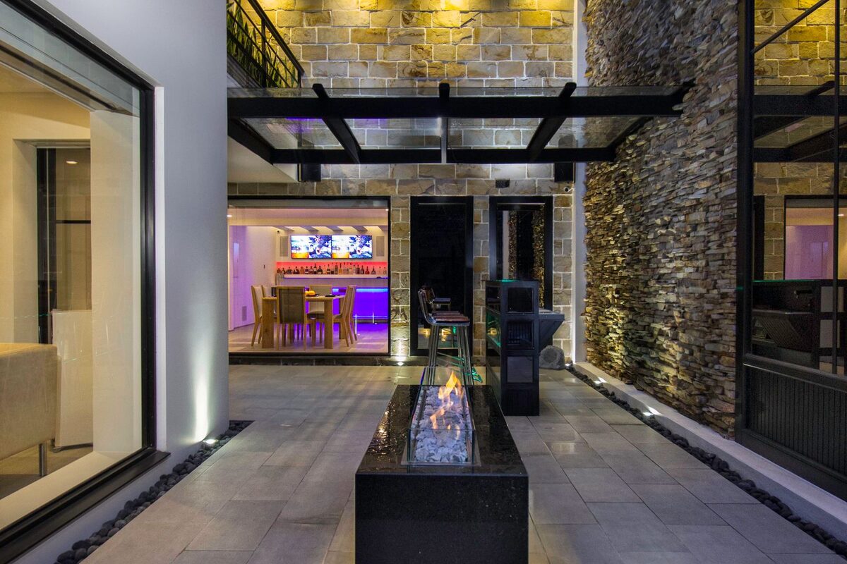 Paver patio with a built-in fire pit and seating in Anchorage