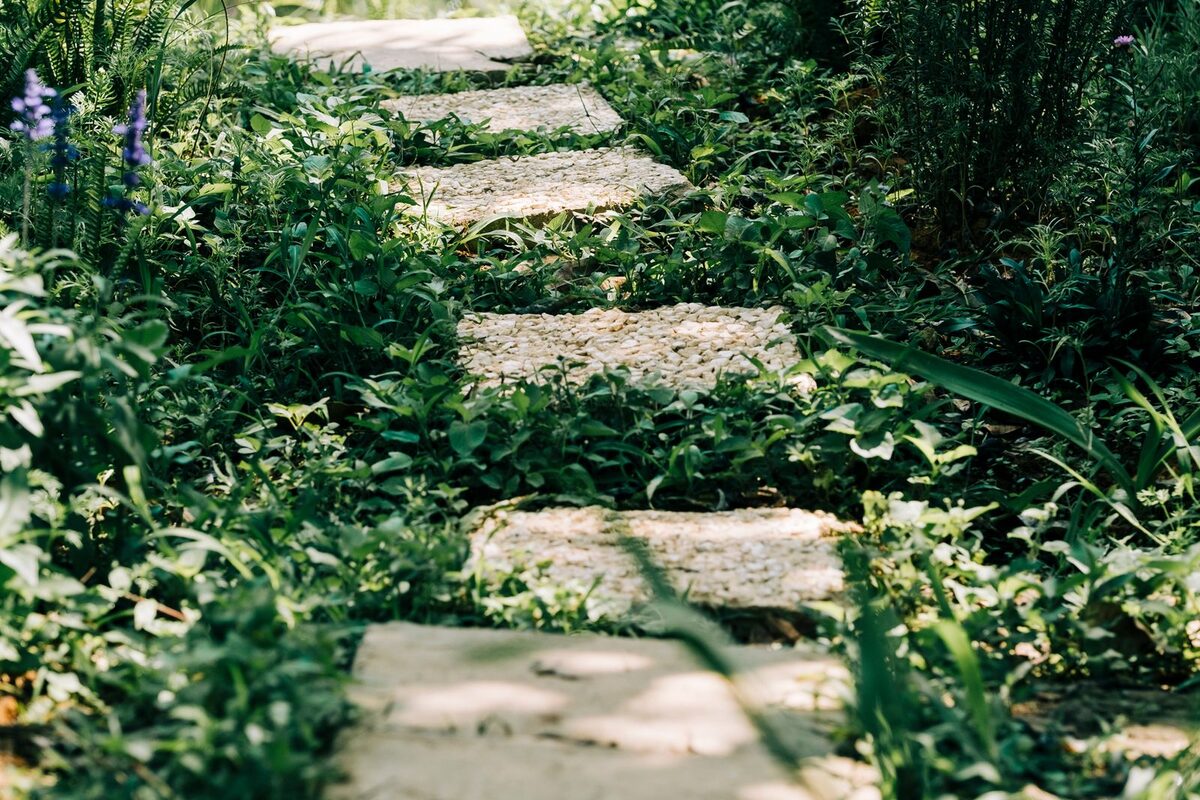 Stone walkway winding through a landscaped garden in Anchorage, AK