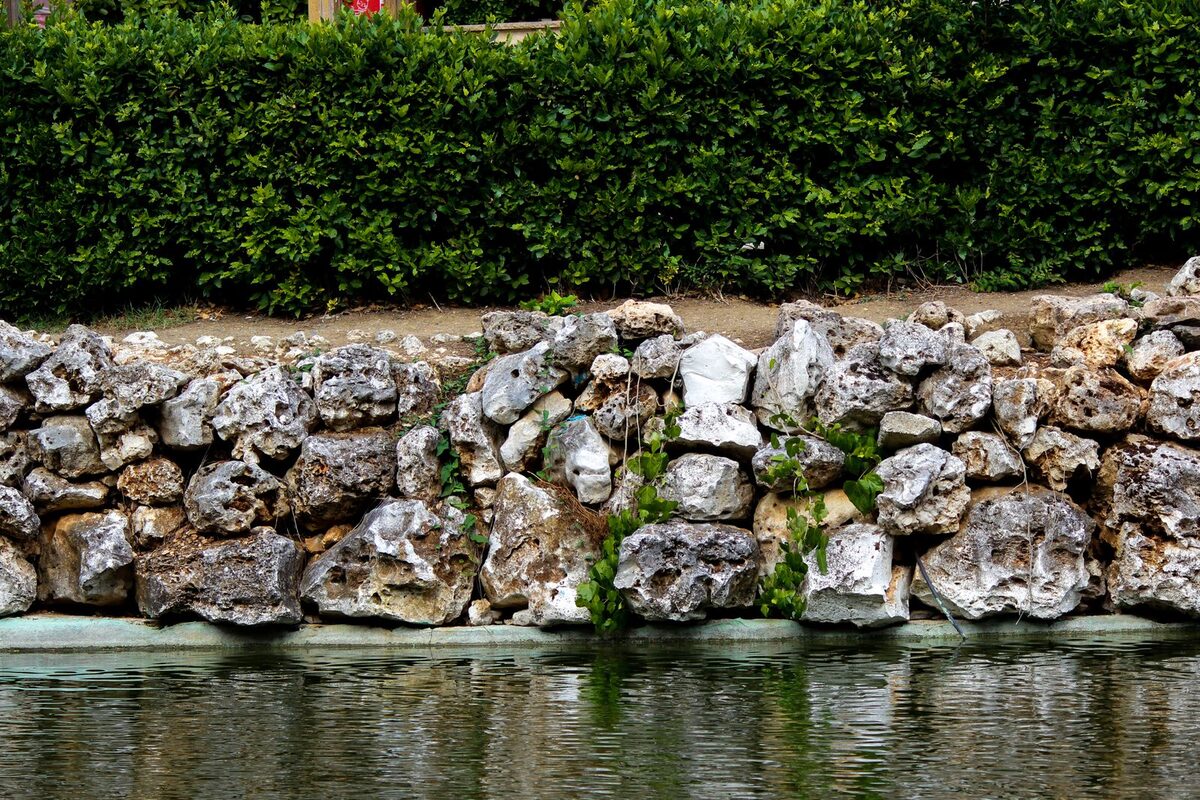 Stone retaining wall in a landscaped Anchorage, AK yard