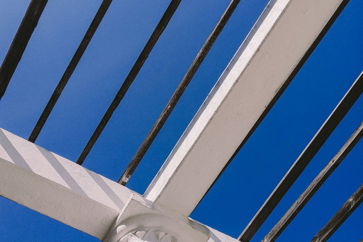 Detail of pergola rafters and beams against the sky