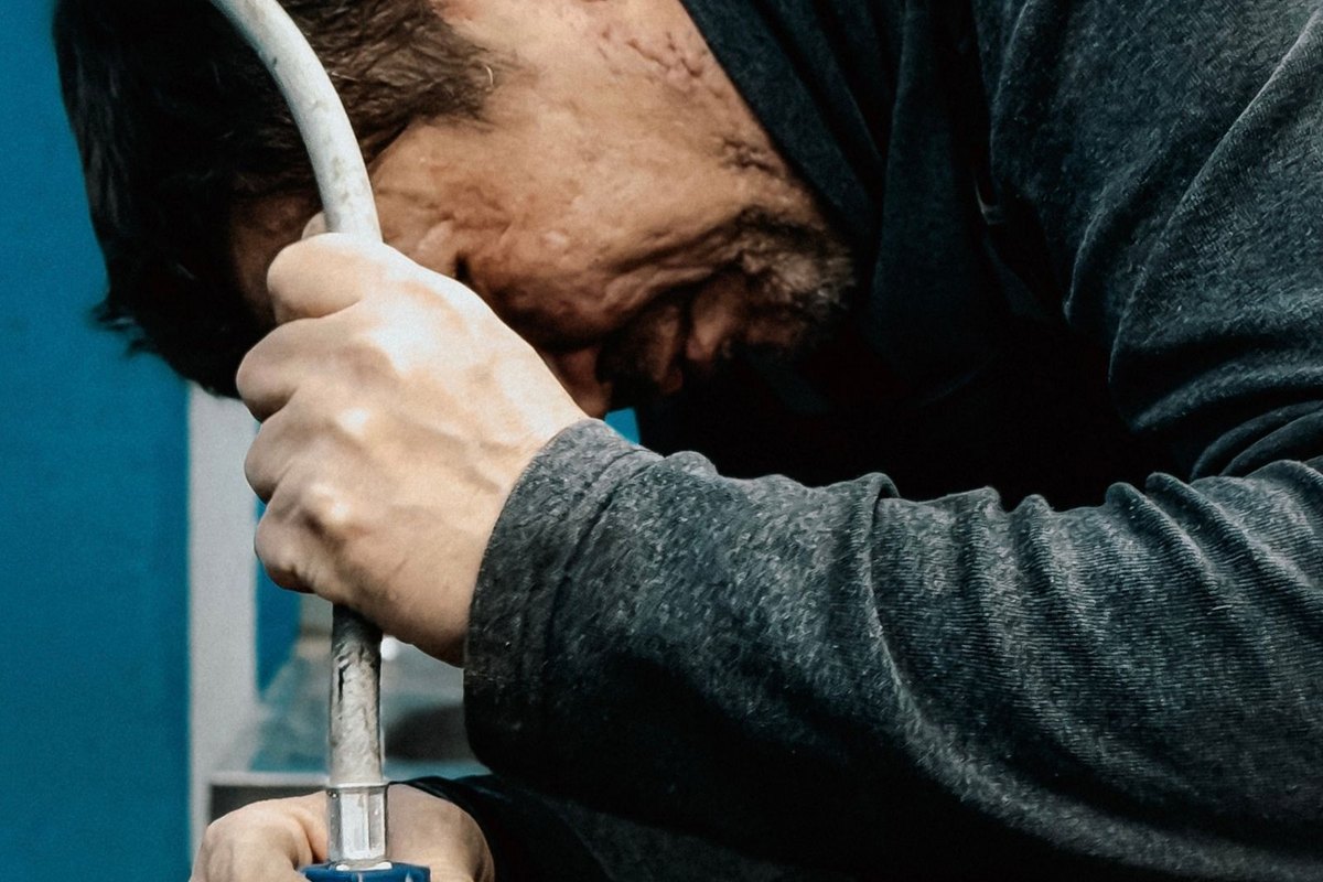 A technician working on a water pump