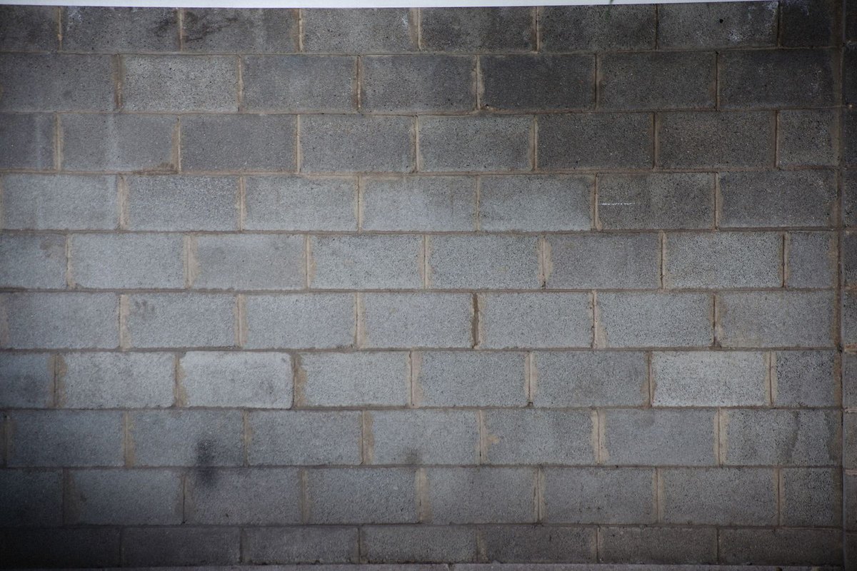 Concrete block wall on a landscaped property in Anchorage, AK