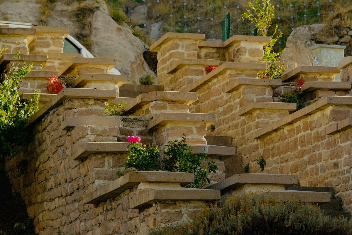 Tiered retaining wall creating level garden terraces in Anchorage