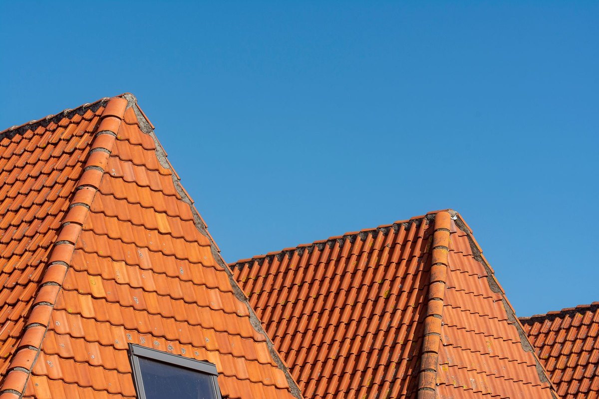 Clean red tile roofs under a clear sky in Anchorage, AK