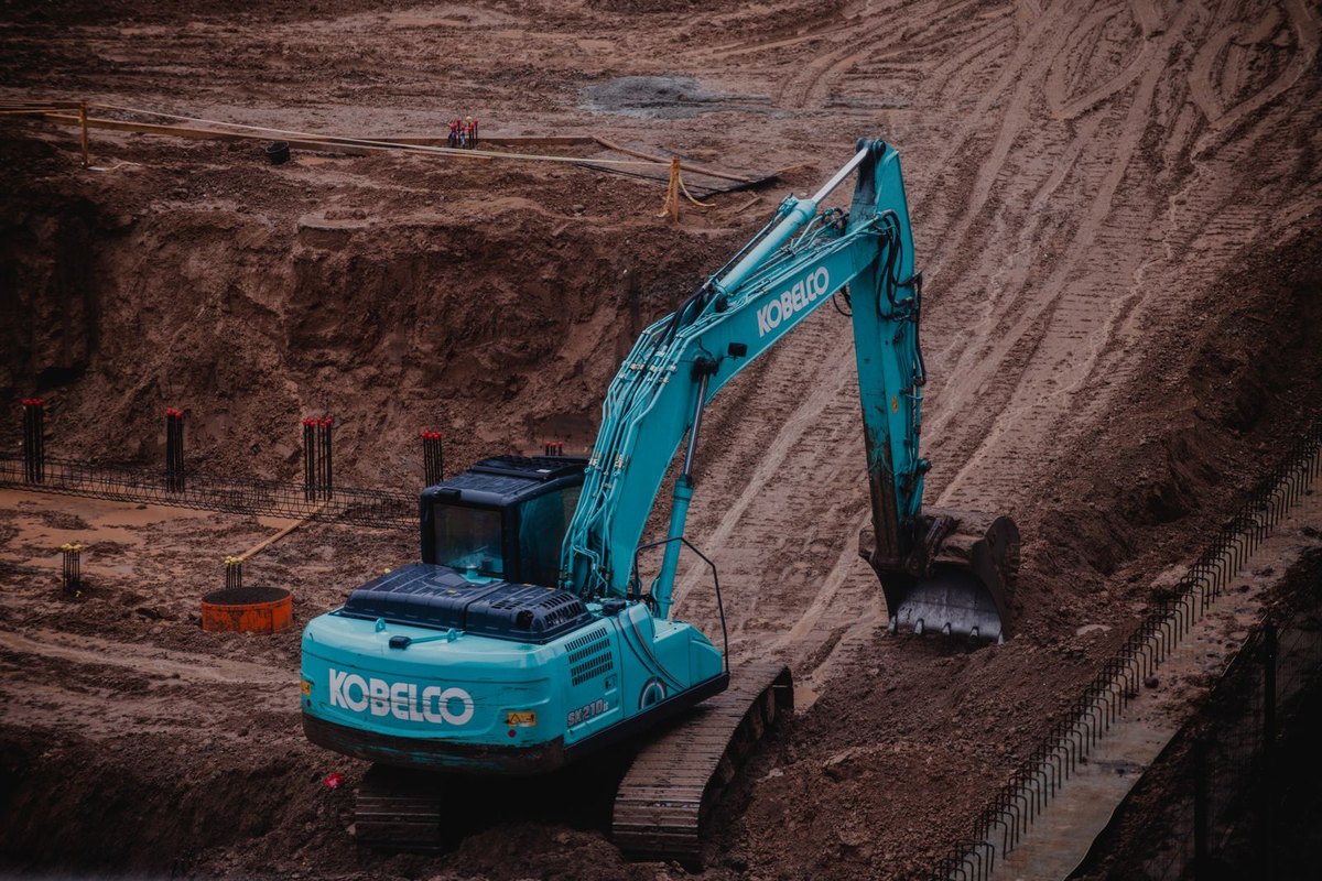 An excavator digging in soil