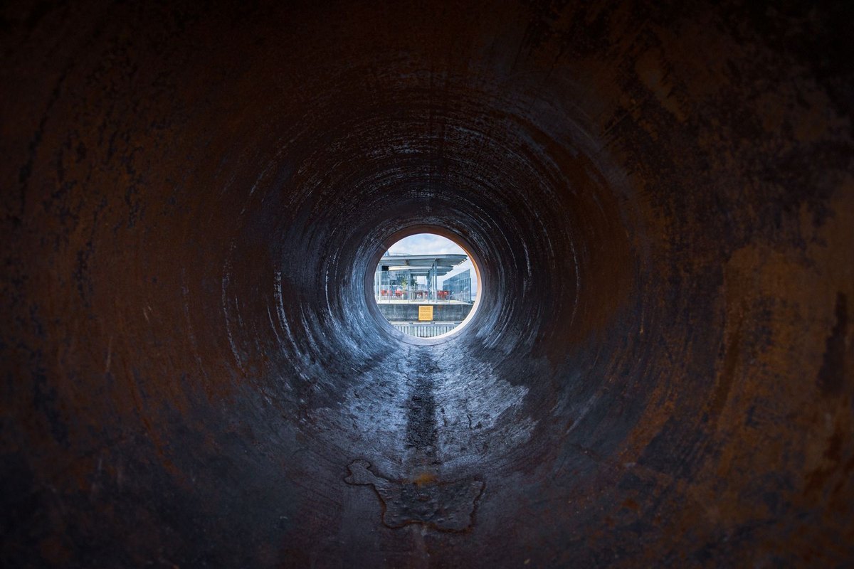 Looking down the inside of a large pipe — the view a sewer camera sends back — in Anchorage, AK