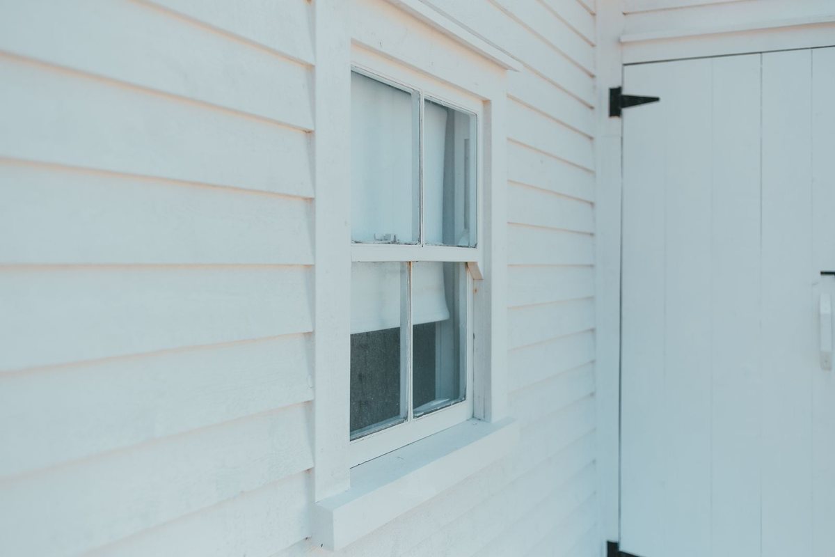 Painted lap-board siding on a home exterior in Anchorage, AK