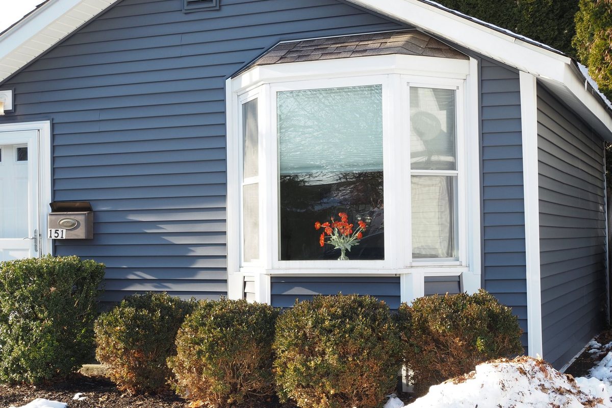 Finished home exterior with fresh siding in Anchorage