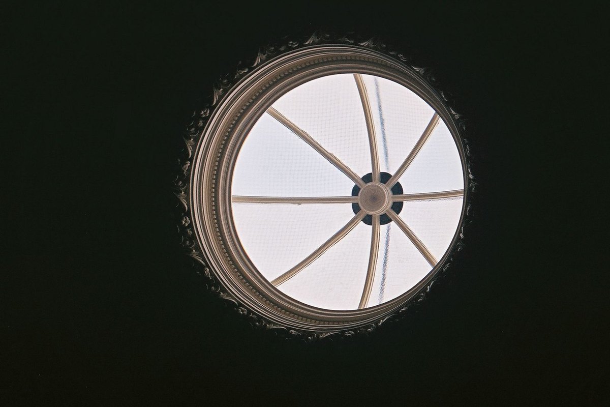 Round skylight seen from below — the kind of round daylight opening a sun tunnel delivers, in Anchorage, AK