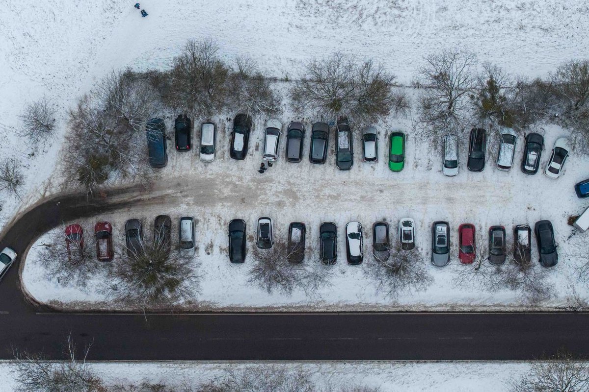 Snow-covered commercial parking lot in winter in Anchorage, AK