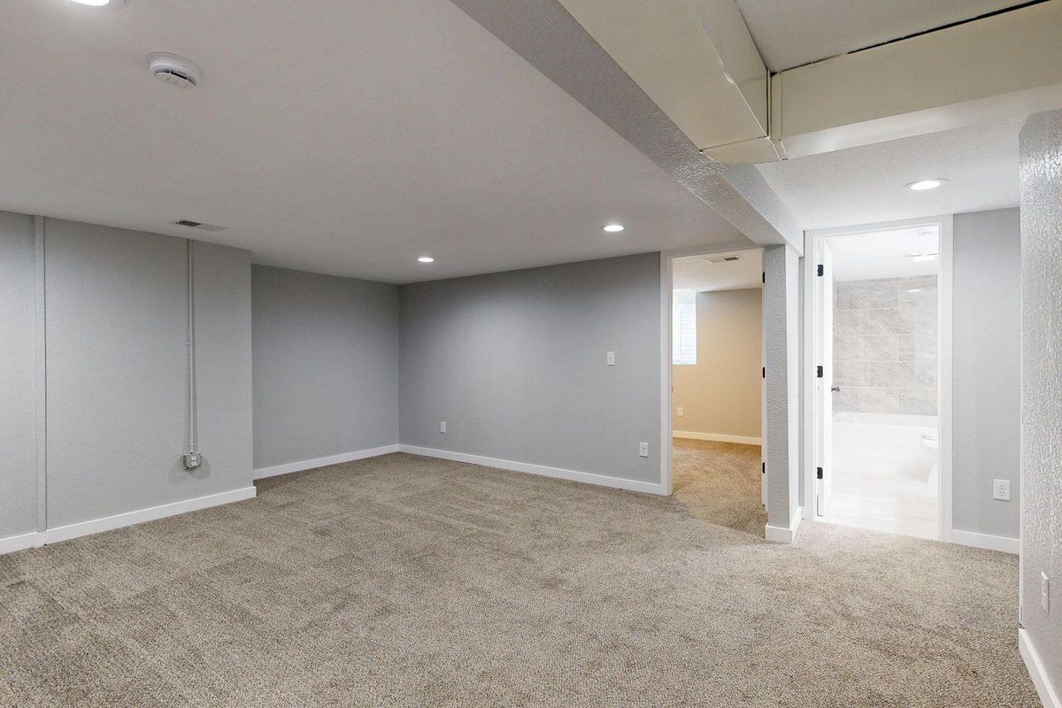 A clean, finished basement room