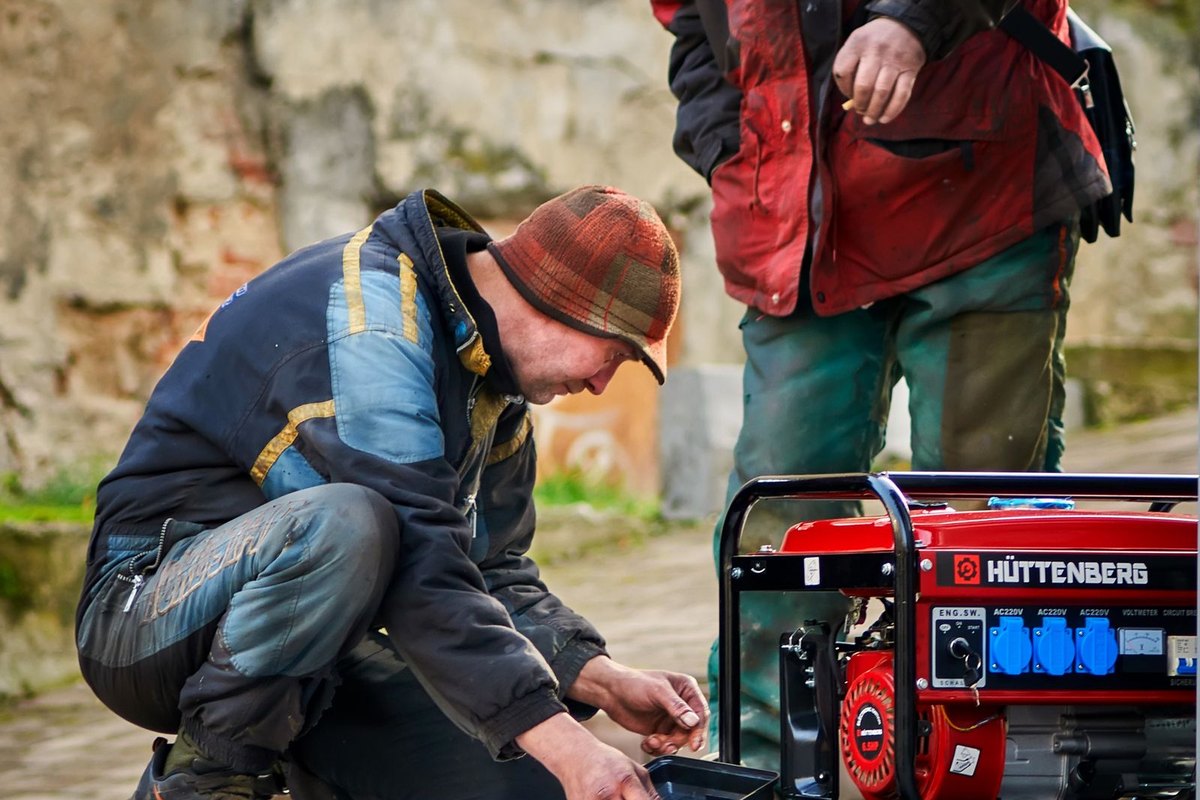 Outdoor power generator unit serviced by technicians, Anchorage, AK