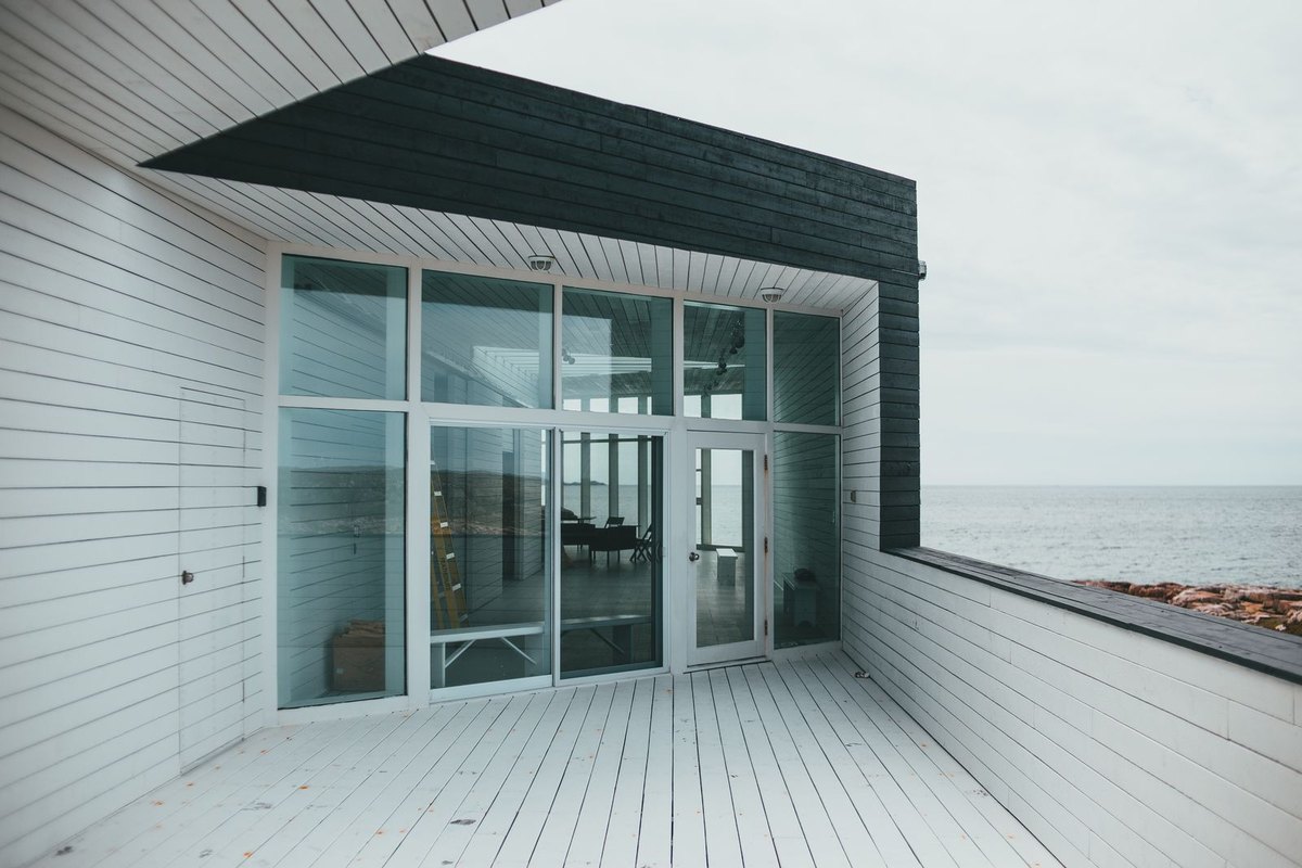 A large glass window and door in a modern home in Anchorage, AK